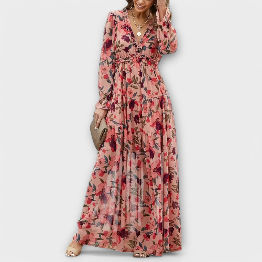 Flowing floral maxi dress with long sleeves and a V-neckline in soft blush pink