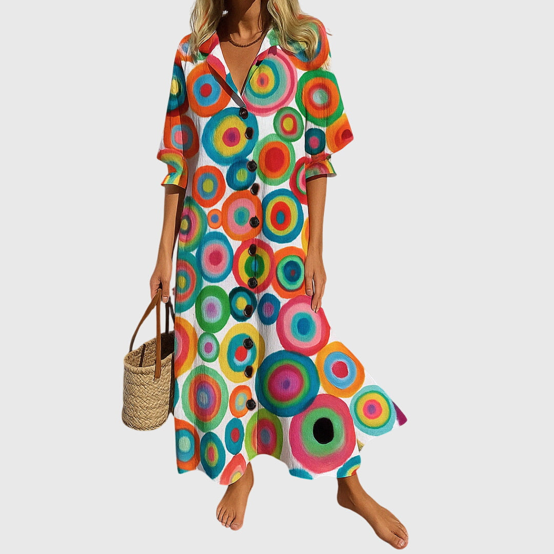Woman wearing a romantic bohemian maxi dress with delicate patterns and a softly draped silhouette.