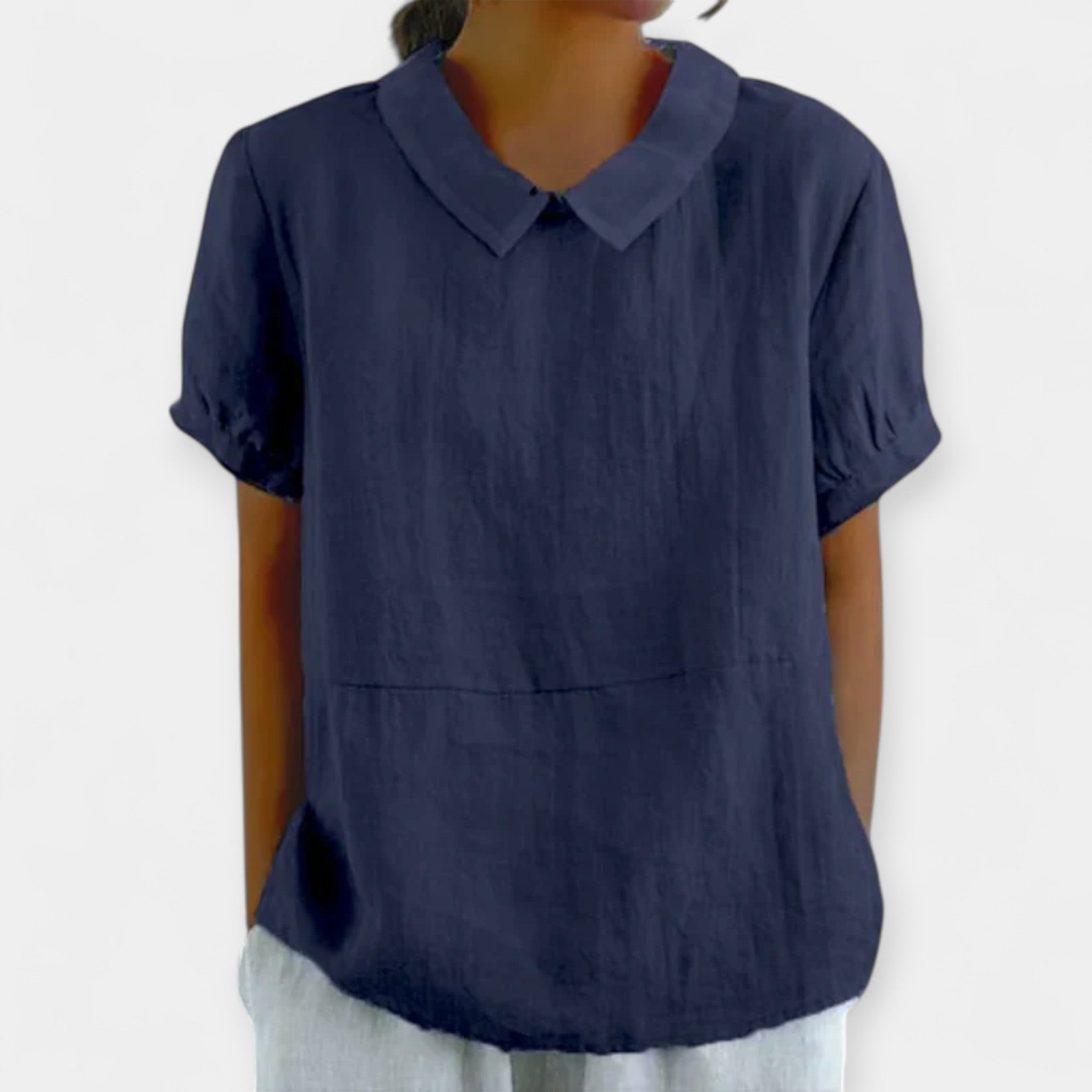 Women's fitted collar-neck top in pale blue with delicate embroidery and button detailing
