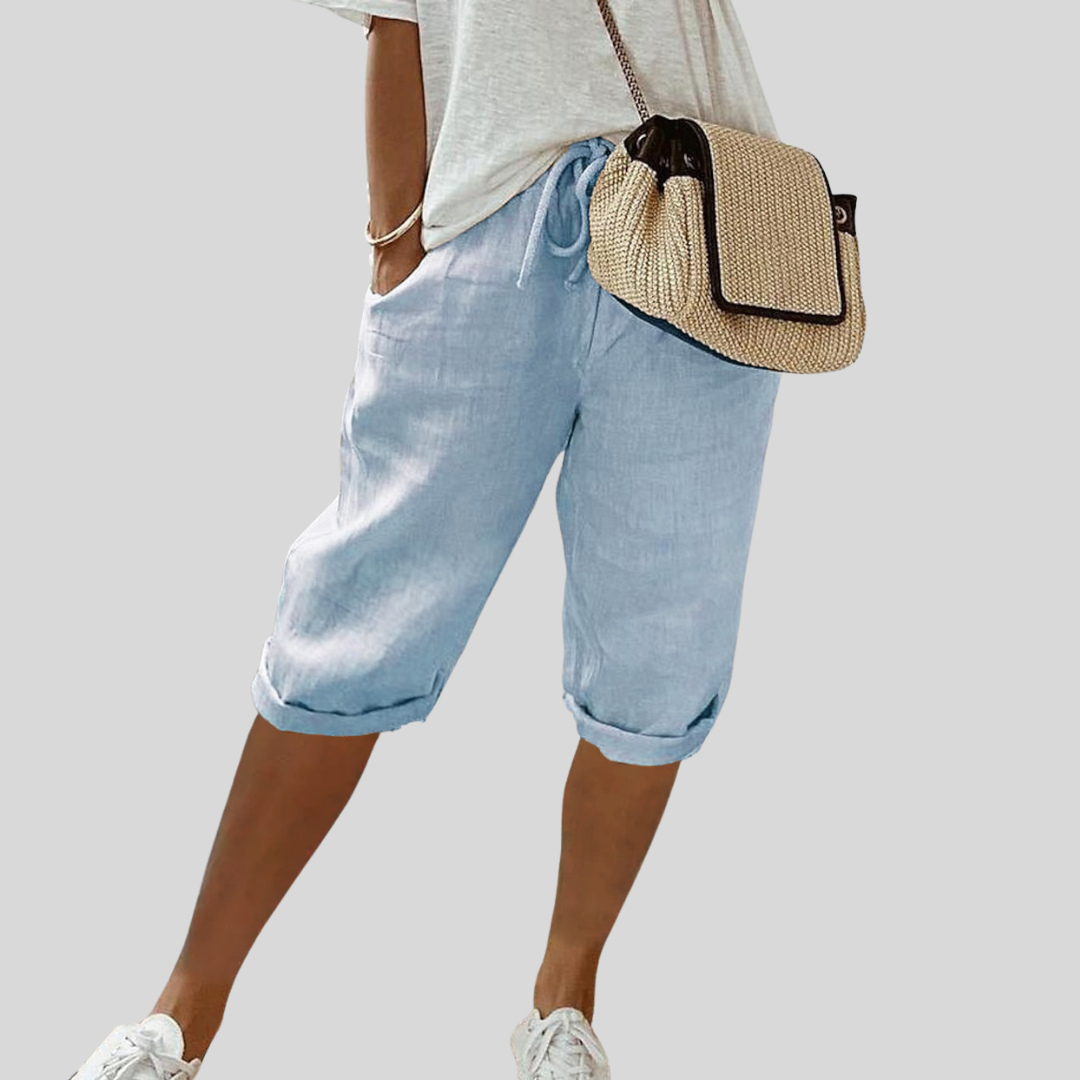 Wide-leg high-waist trousers in a neutral beige tone