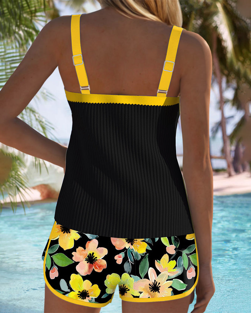 Tankini set with orange tropical-print shorts and matching top
