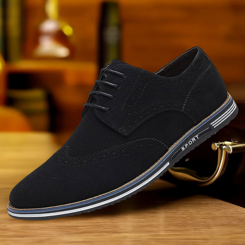 Men's black luxury dress shoes with a sleek pointed silhouette and polished smooth upper