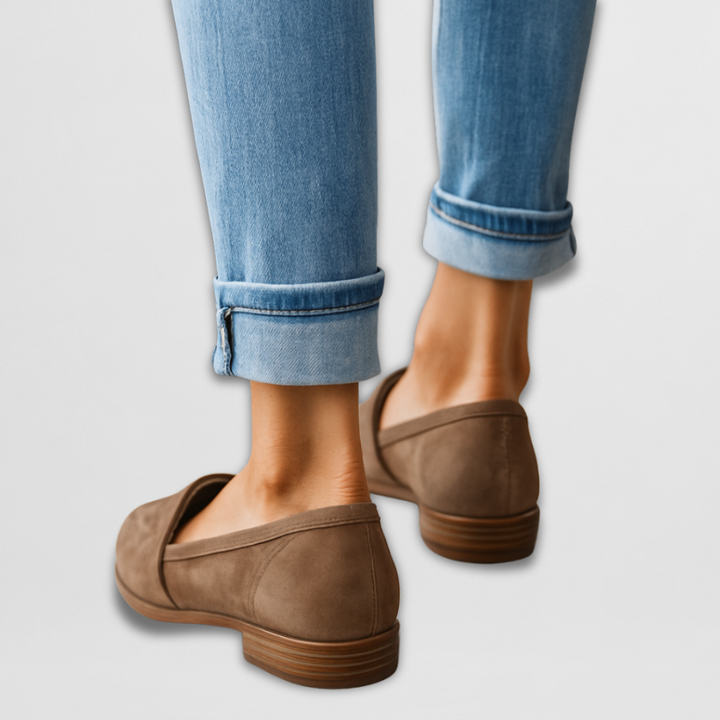 A woman wearing soft-touch loafers on a relaxed day out.