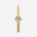 Women's minimalist gold watch with a simple round face and clean gold-tone finish