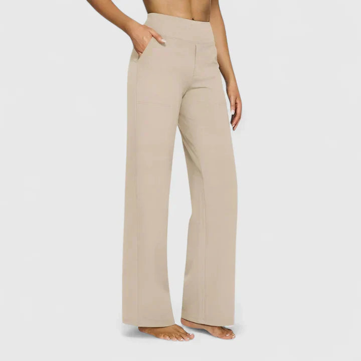 A woman in elegant straight-leg trousers with pockets, styled for a polished everyday look.
