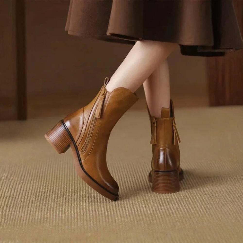 Classic black ankle boots with a stable heel and side zip fastening