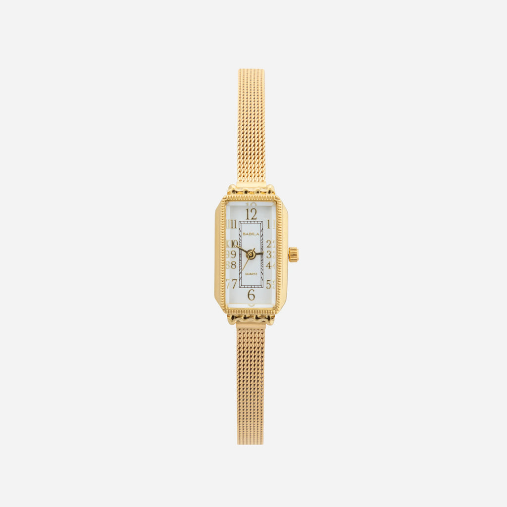 Women's classic watch with a textured strap and rounded dial in warm gold tone
