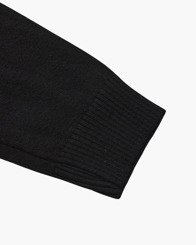 Men's black ribbed roll-neck jumper with a clean structured silhouette