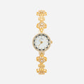 Women's gold-finish watch with rounded design and light-catching detailed face