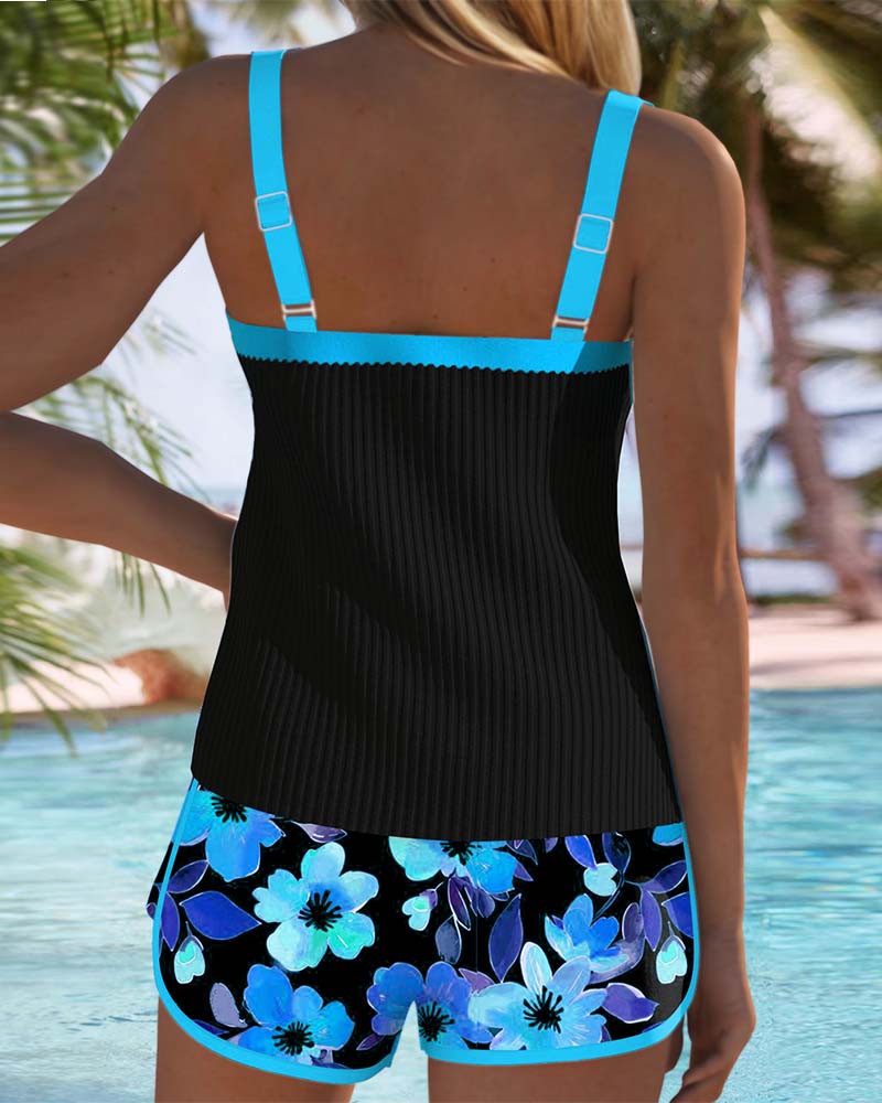 Tankini set with orange tropical-print shorts and matching top