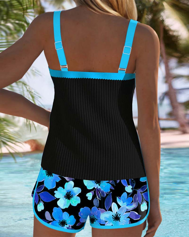 Tankini set with orange tropical-print shorts and matching top