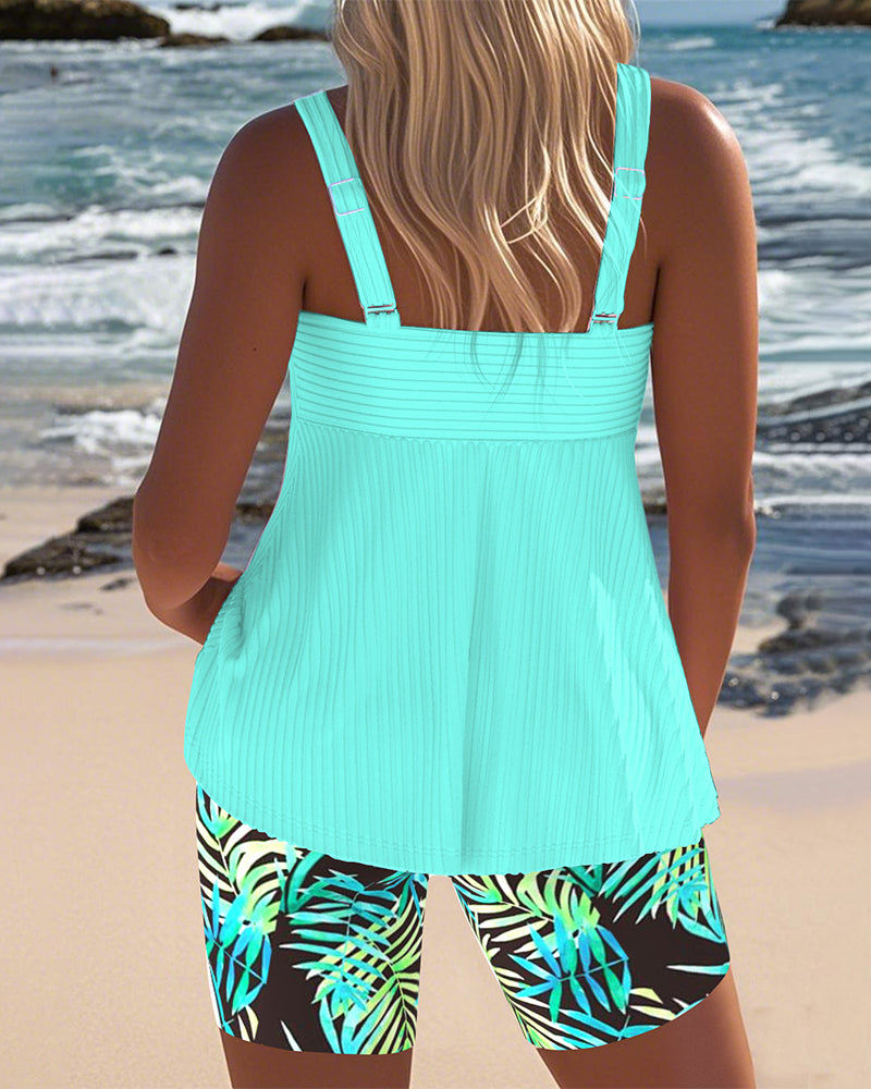 Printed tankini swimsuit in cyan with a colourful patterned bottom