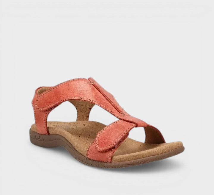 Elegant flat T-bar sandals in black and beige with a classic, refined strap design