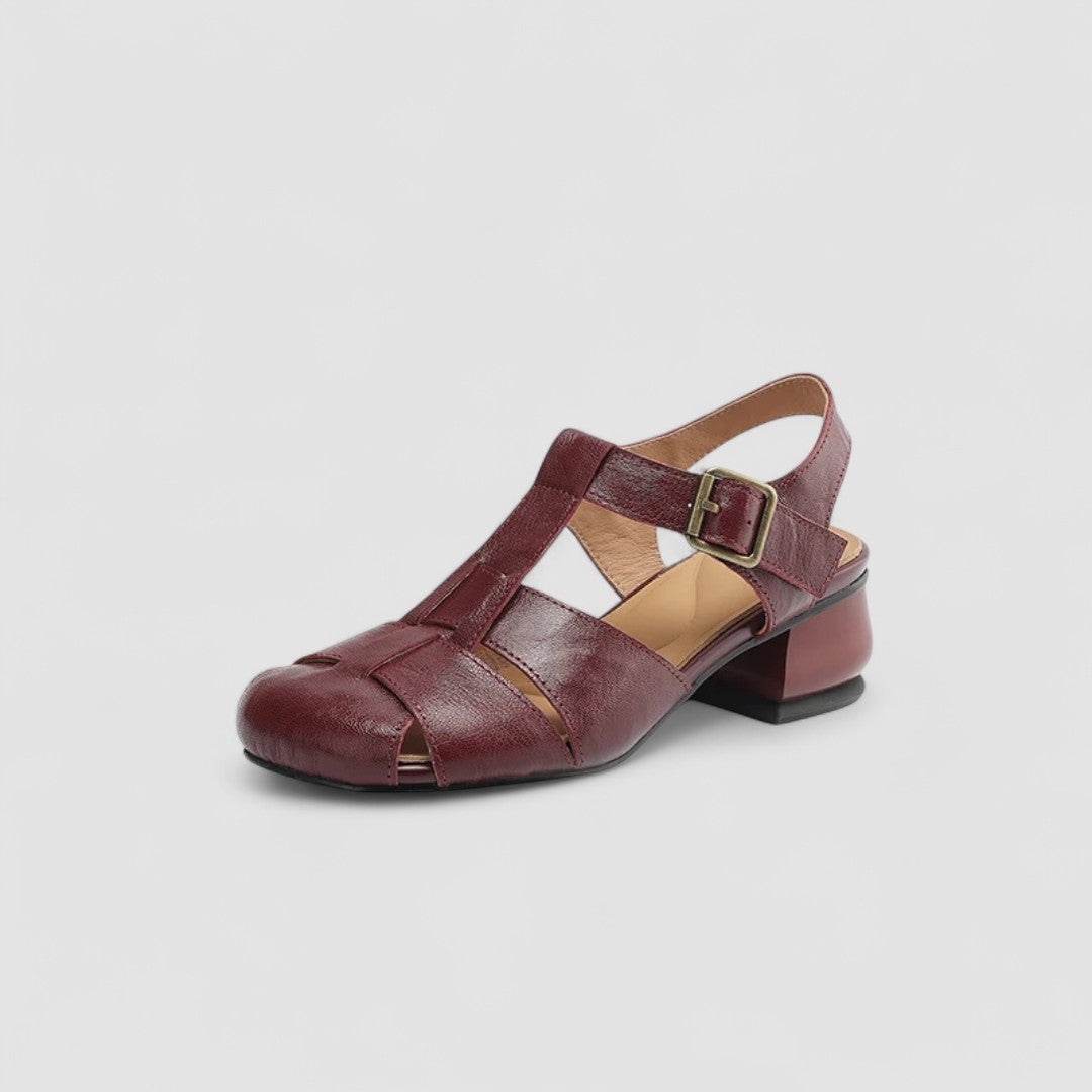 A woman in beige Mary Jane shoes with an ankle strap, comfortable browsing a market.