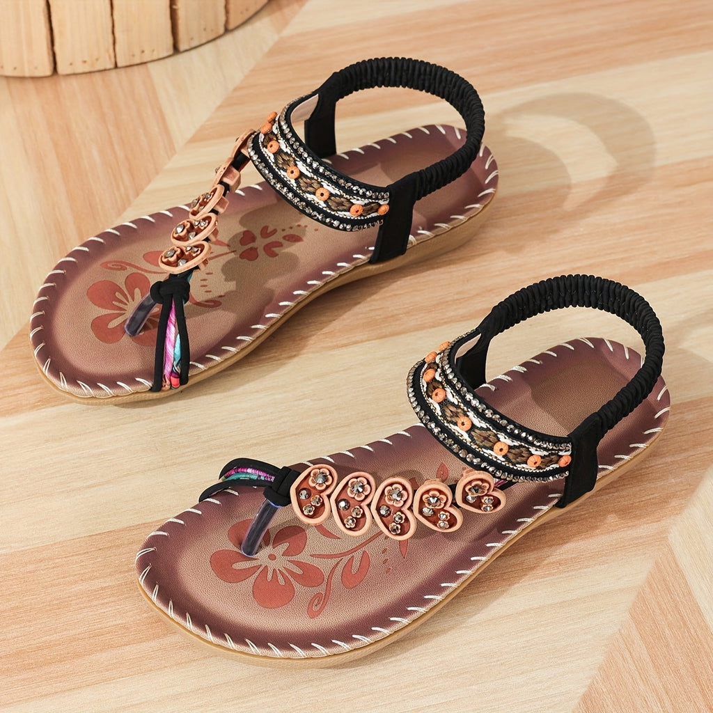 Beaded boho flat sandals in brown with decorative bead detailing and an elastic ankle strap