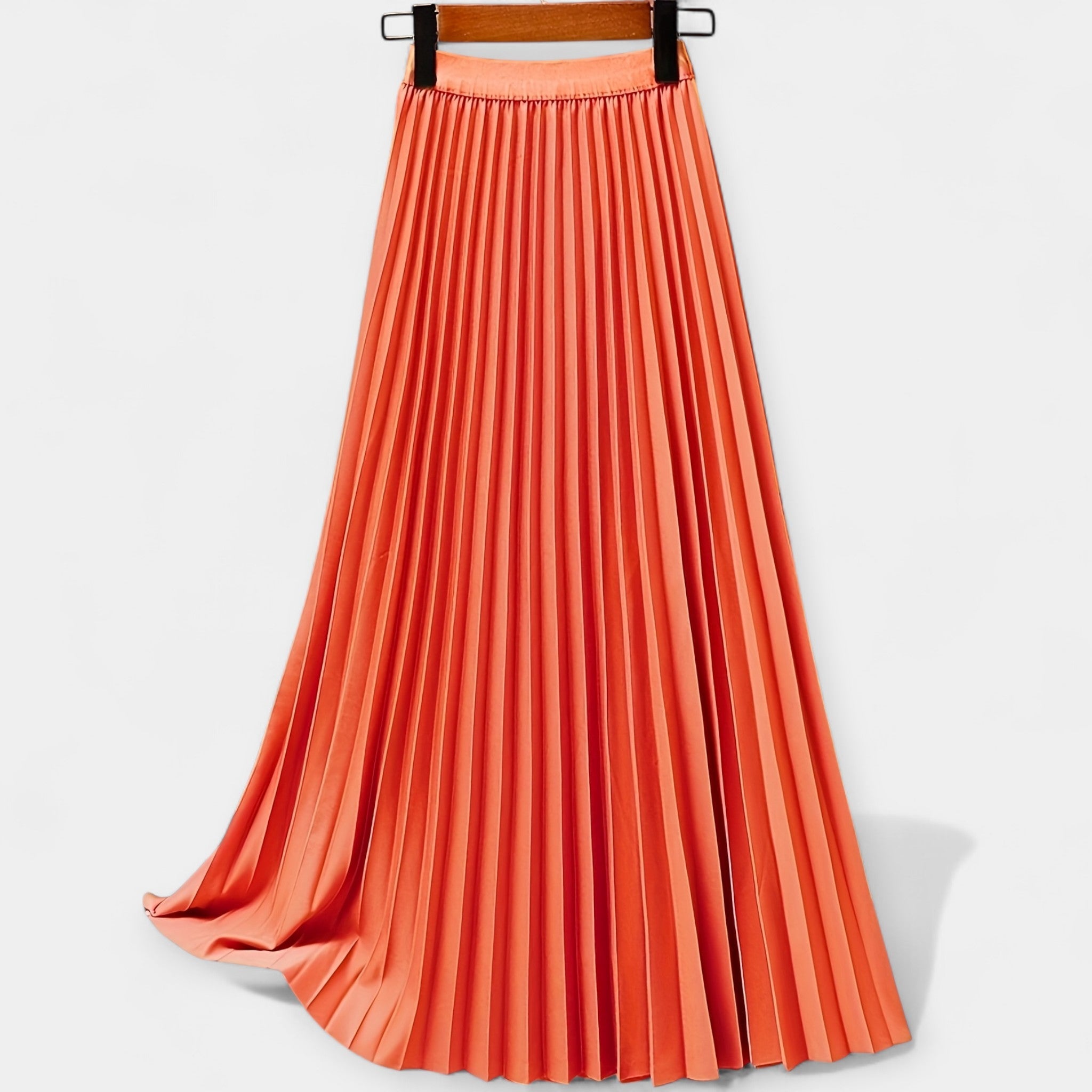 Wide pleated high-waist midi skirt in soft blush pink with a flowing silhouette