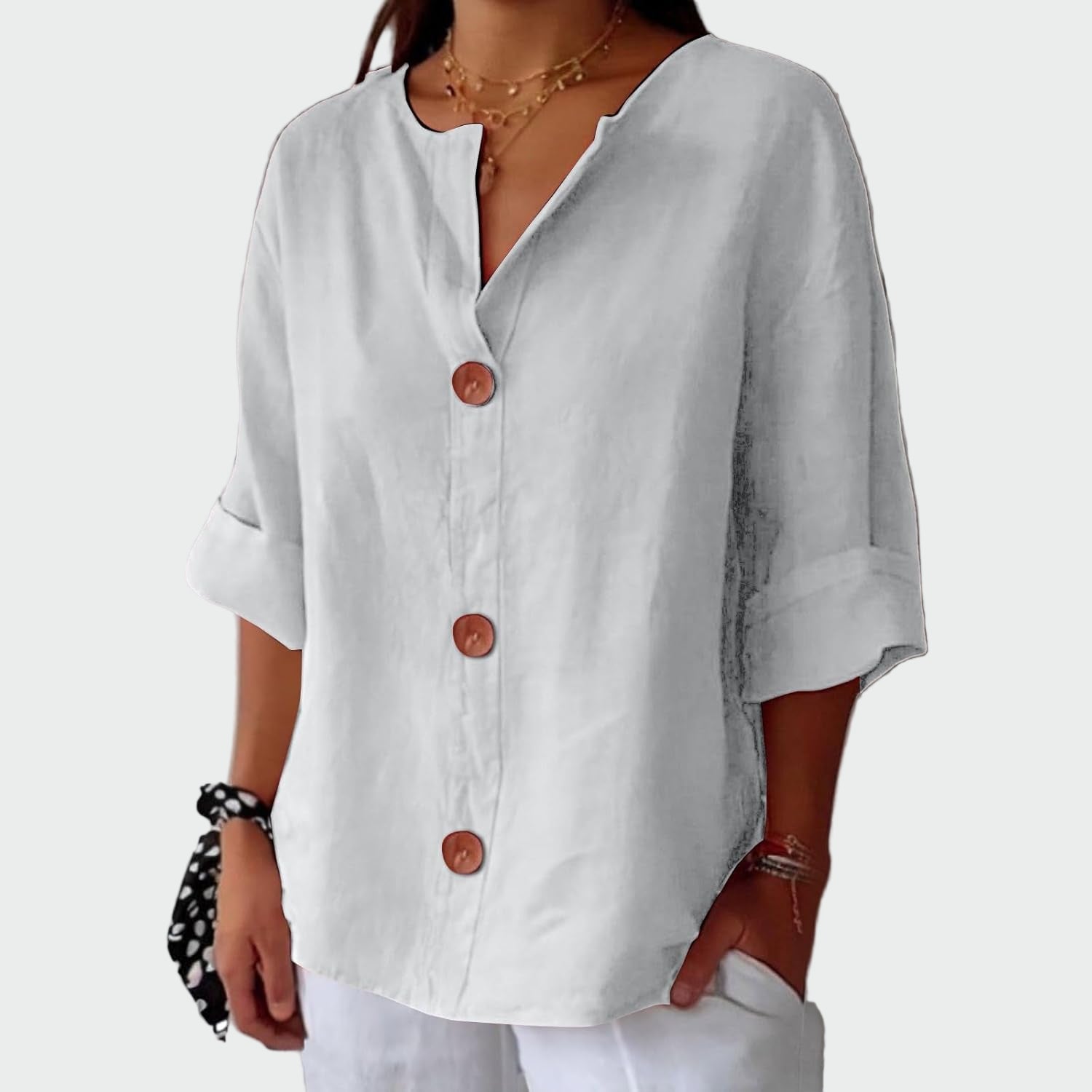 Cream relaxed-fit women's blouse with three-quarter sleeves and wooden front detail