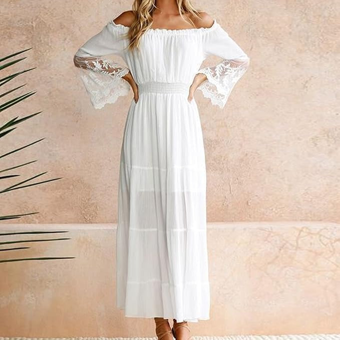 Woman wearing a romantic off-shoulder maxi dress with sheer embroidered sleeves at an evening celebration.