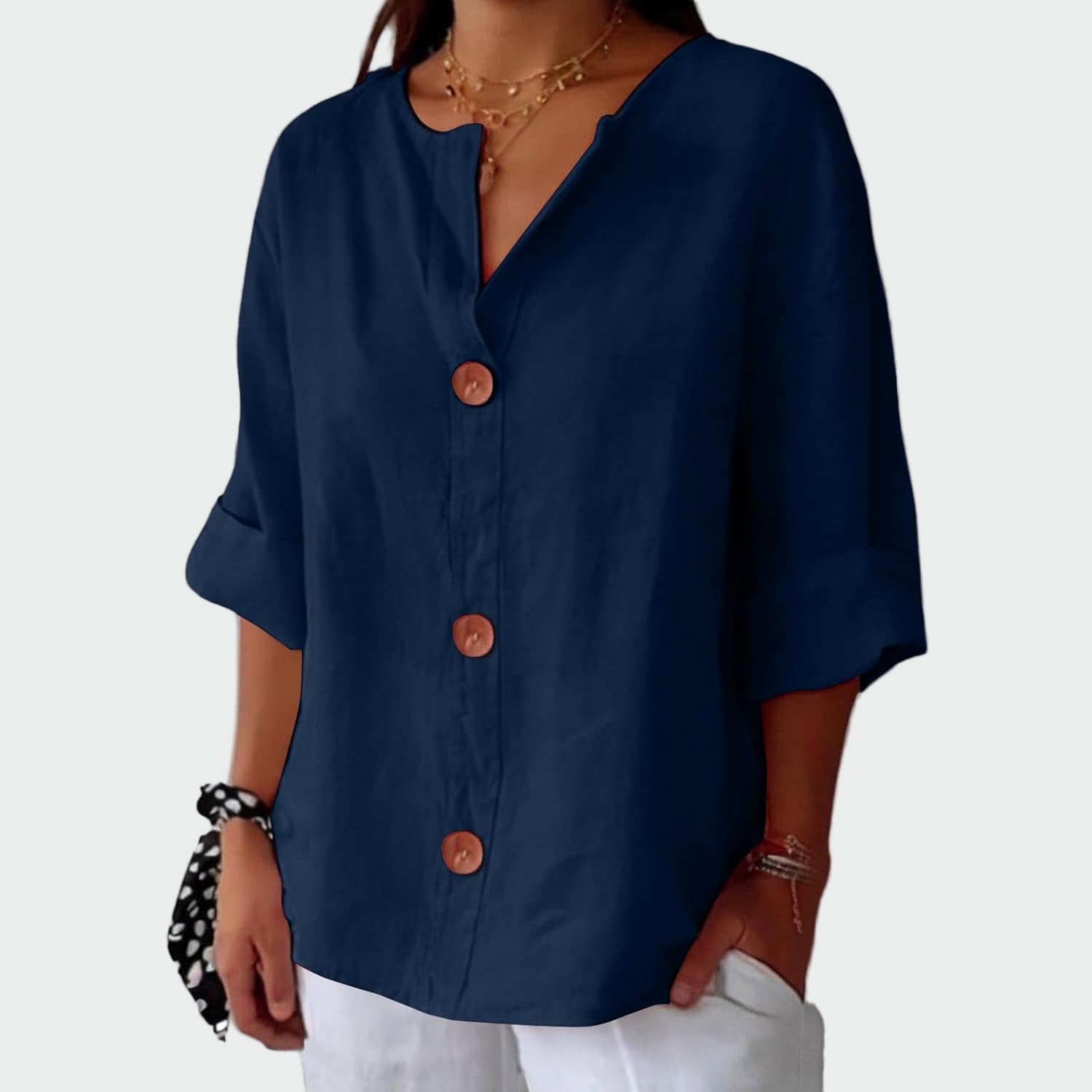 Relaxed ecru blouse with three-quarter sleeves and a natural minimalist front detail
