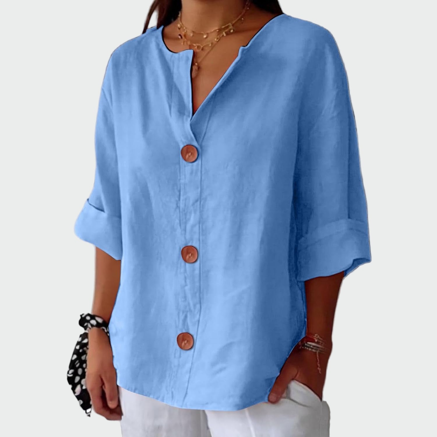 Cream relaxed-fit women's blouse with three-quarter sleeves and wooden front detail