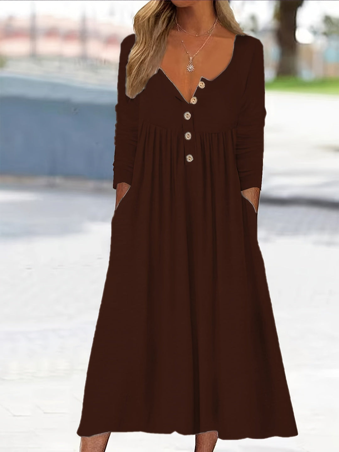 A woman wearing the Bernadette button-front midi dress with an A-line skirt, dressed for a casual day out.