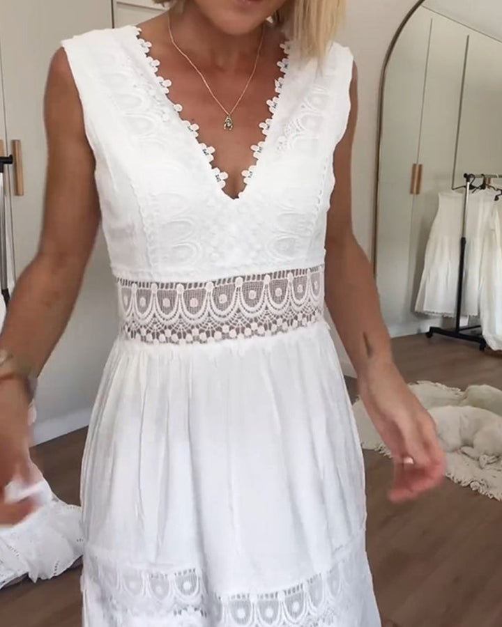 Woman wearing the Marian™ camisole maxi dress with delicate detailing and a flowing skirt at a summer gathering.