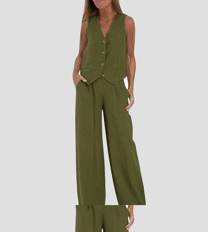 A woman wearing a tailored waistcoat with flowing wide-leg trousers