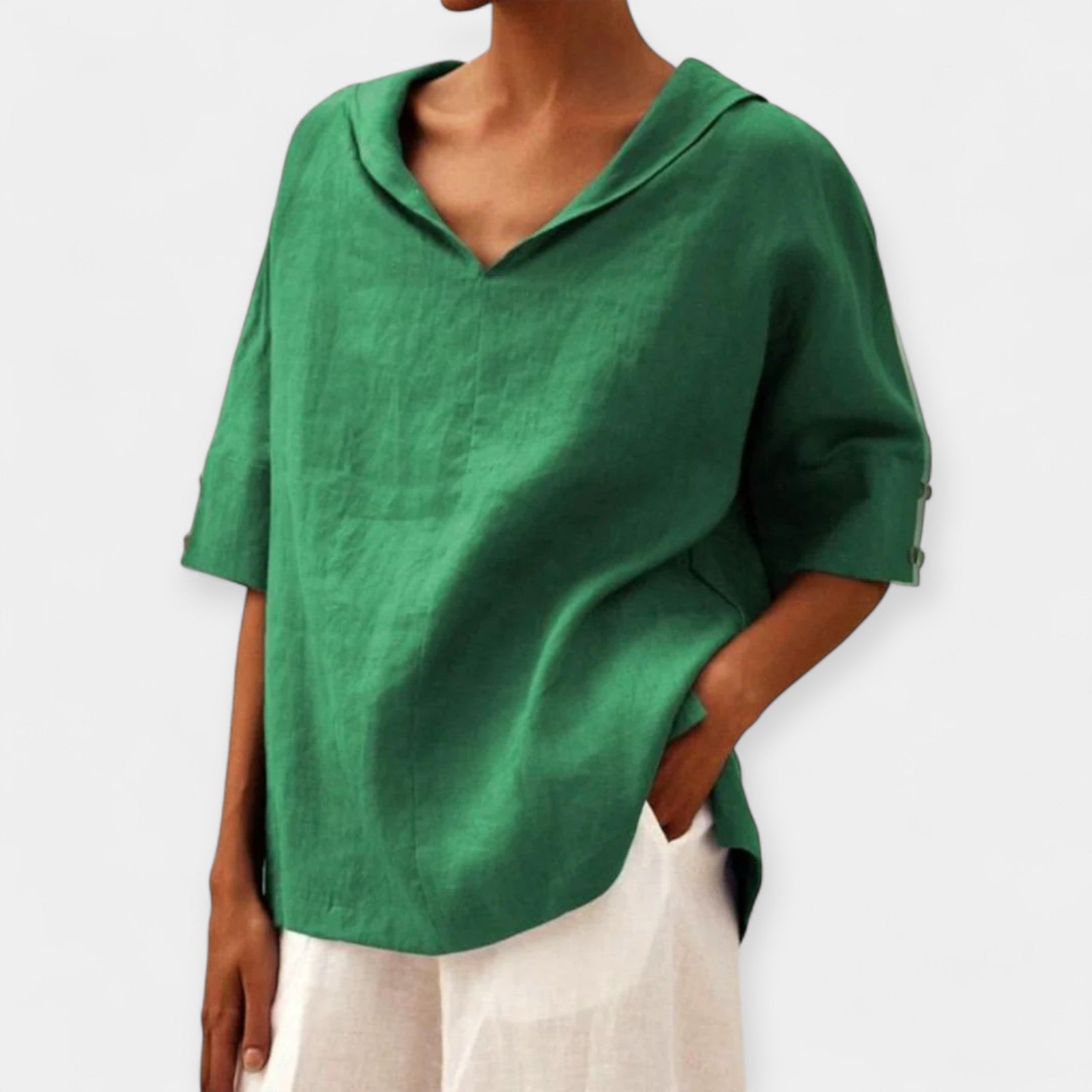 Women's relaxed blouse in green with a distinctive wide neckline and easy-fitting silhouette