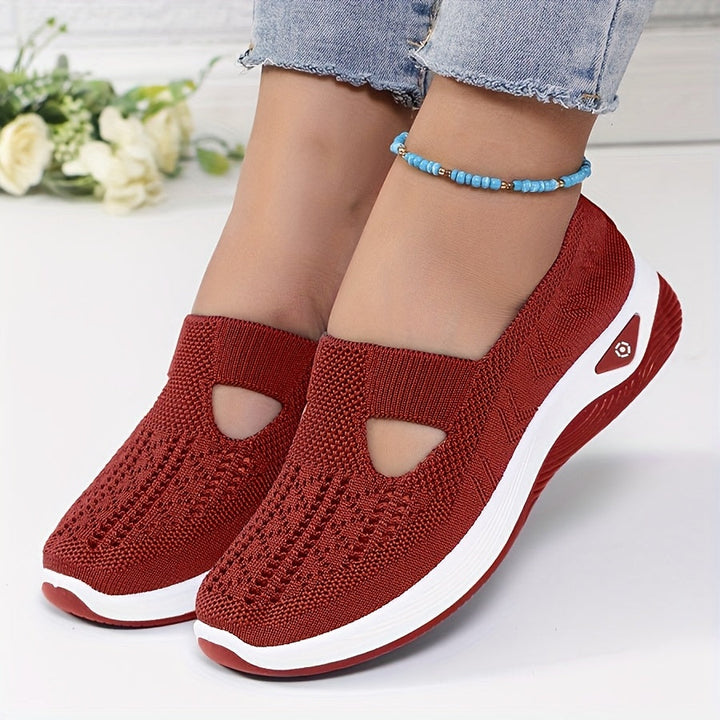 A woman stepping into easy slip-on comfort trainers with no laces.