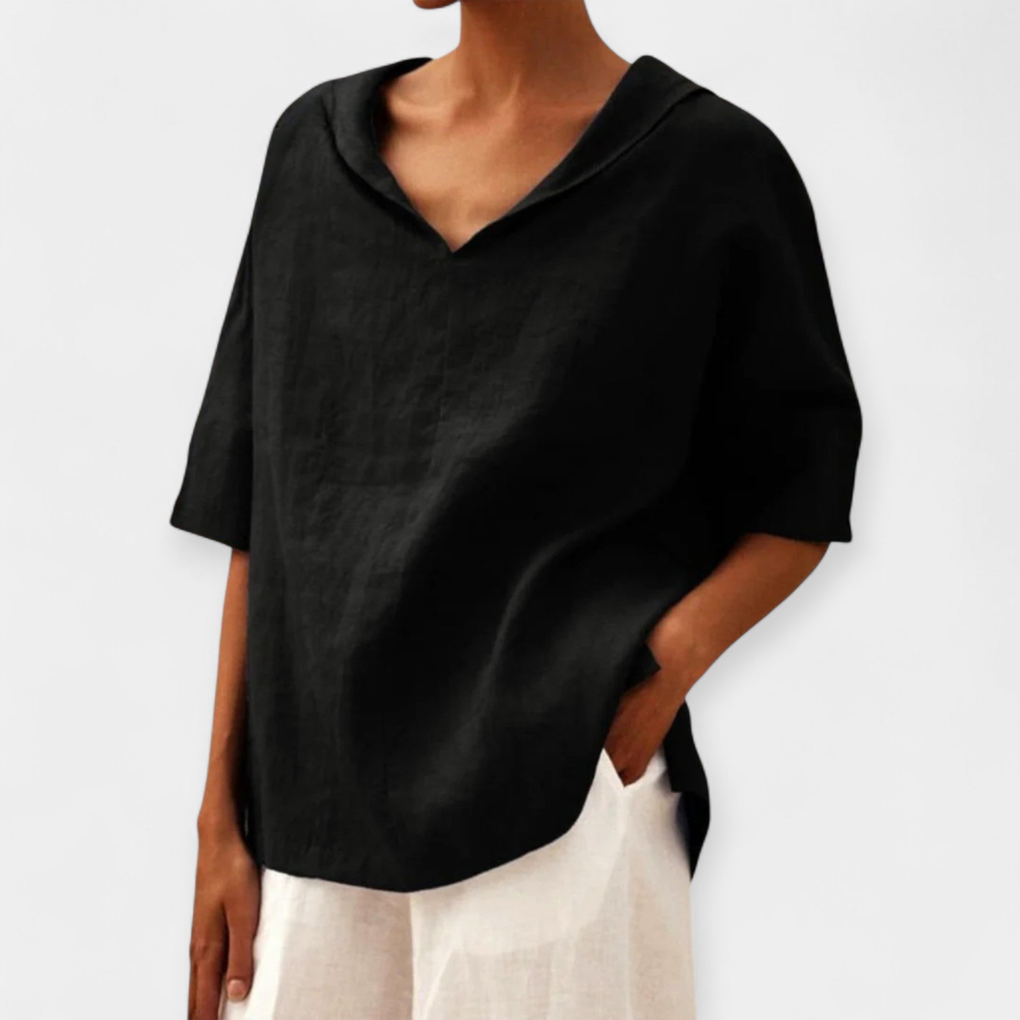 Women's relaxed blouse in green with a distinctive wide neckline and easy-fitting silhouette