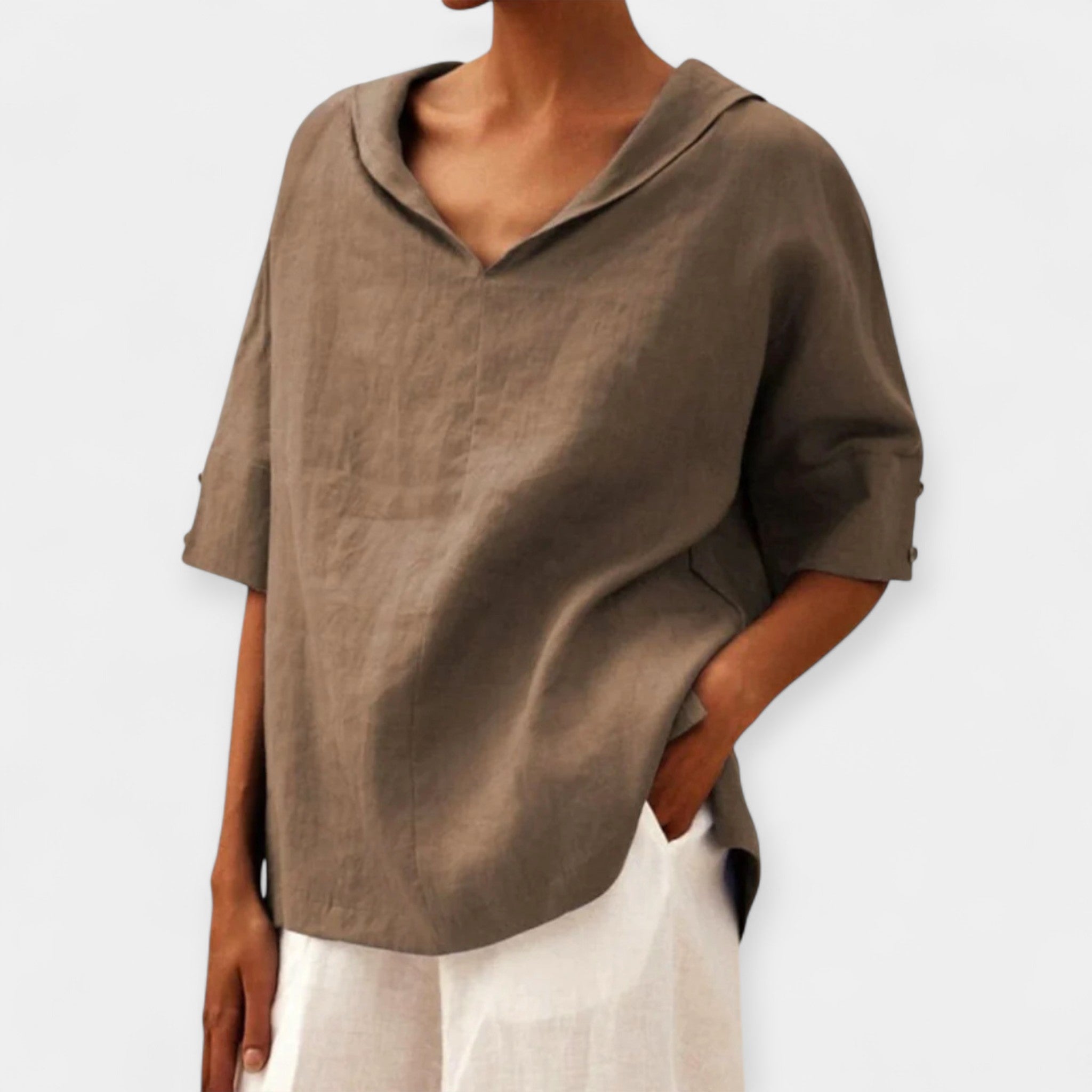 Women's relaxed blouse in green with a distinctive wide neckline and easy-fitting silhouette