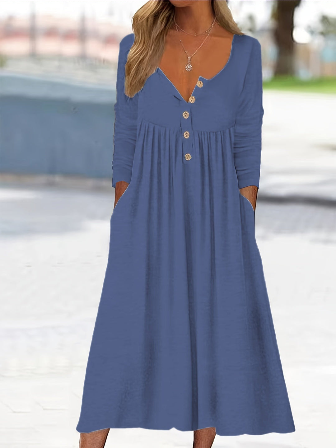 A woman wearing the Bernadette button-front midi dress with an A-line skirt, dressed for a casual day out.