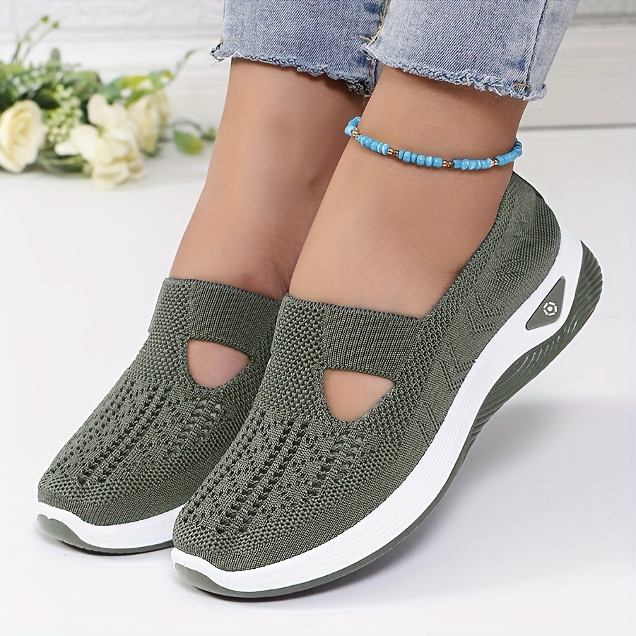 A woman stepping into easy slip-on comfort trainers with no laces.