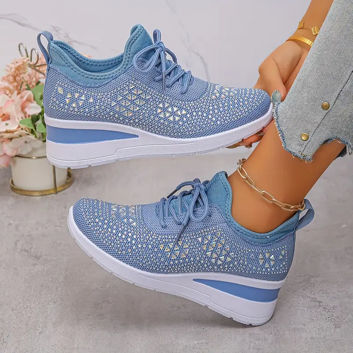 Women's supportive trainers in white with a cushioned sole and clean modern design
