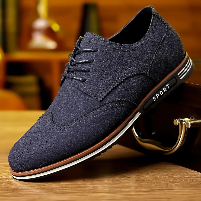 Men's black luxury dress shoes with a sleek pointed silhouette and polished smooth upper