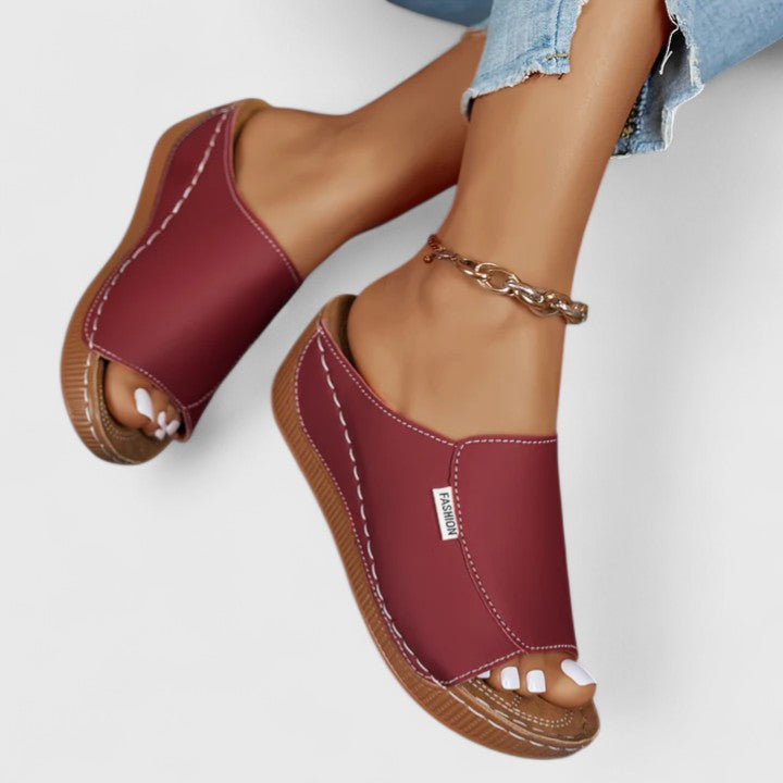 A woman in tan lightweight sandals stepping out gracefully, feet cushioned and supported.