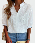 White puff-sleeve blouse with raised floral embroidery and openwork front detail