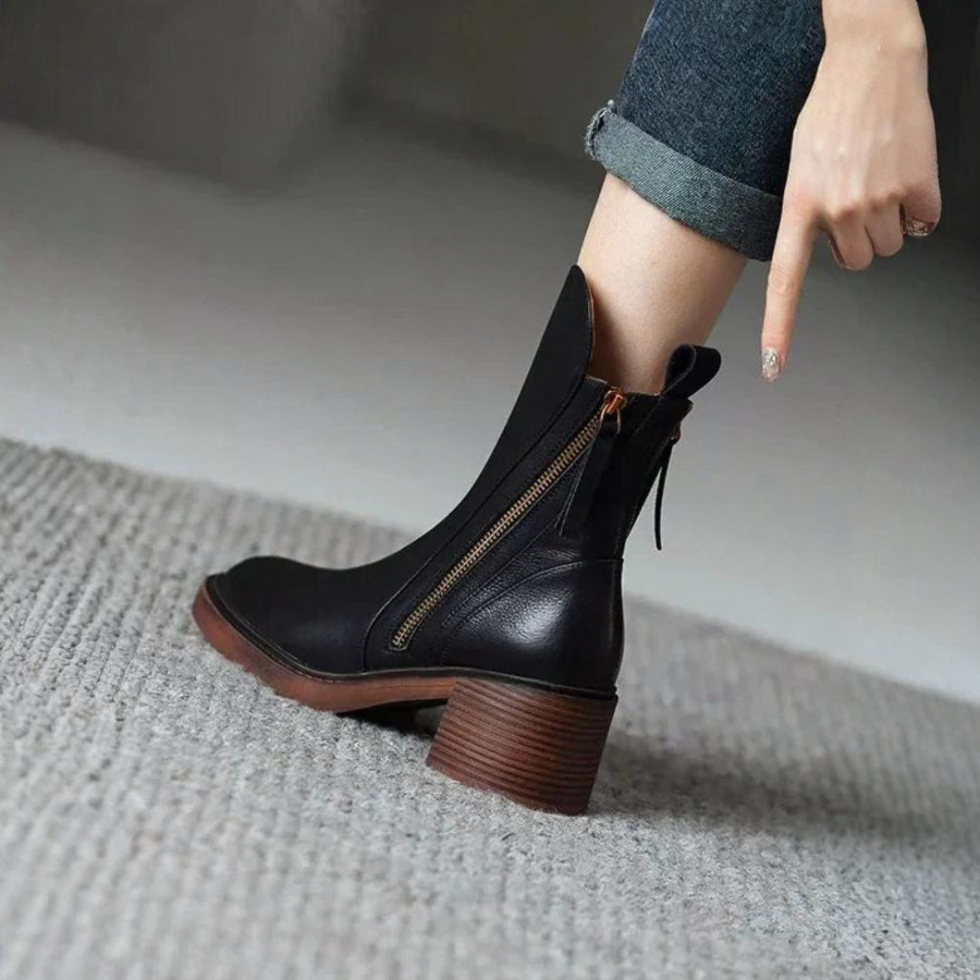 Classic black ankle boots with a stable heel and side zip fastening