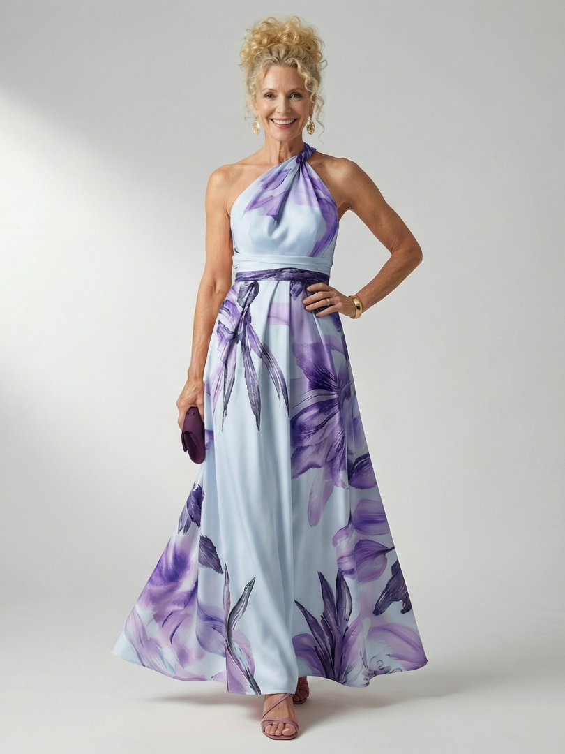 White floral halter-neck maxi dress with large bold print and flowing relaxed skirt