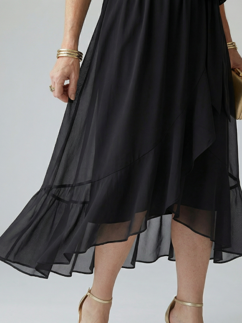 Green floaty midi dress with a draped V-neckline and soft bow waist detail