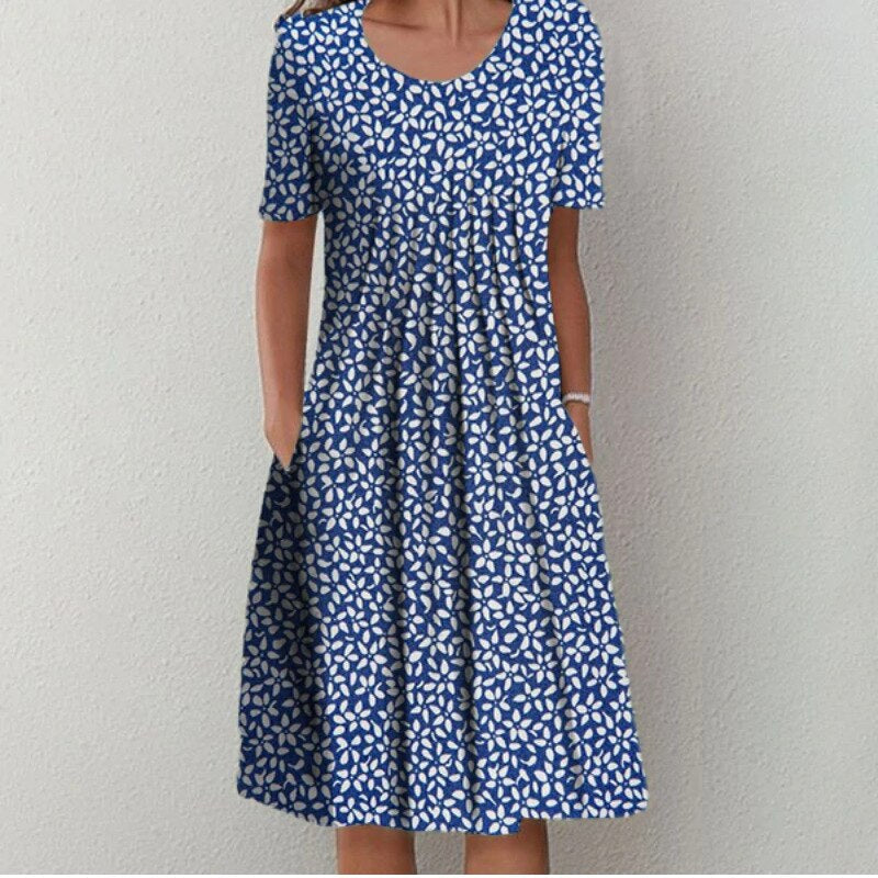 Woman wearing the floral midi dress with pockets, walking outdoors on a sunny day.