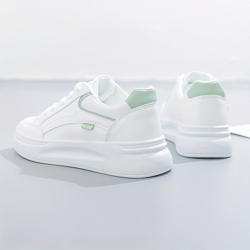 A woman in crisp white light comfort trainers paired with jeans.
