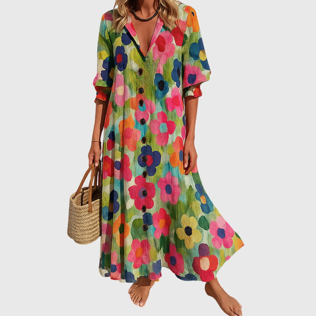 Woman wearing a romantic bohemian maxi dress with delicate patterns and a softly draped silhouette.