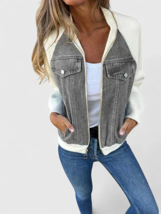 A woman wearing a V-neck zip jacket with a relaxed fit