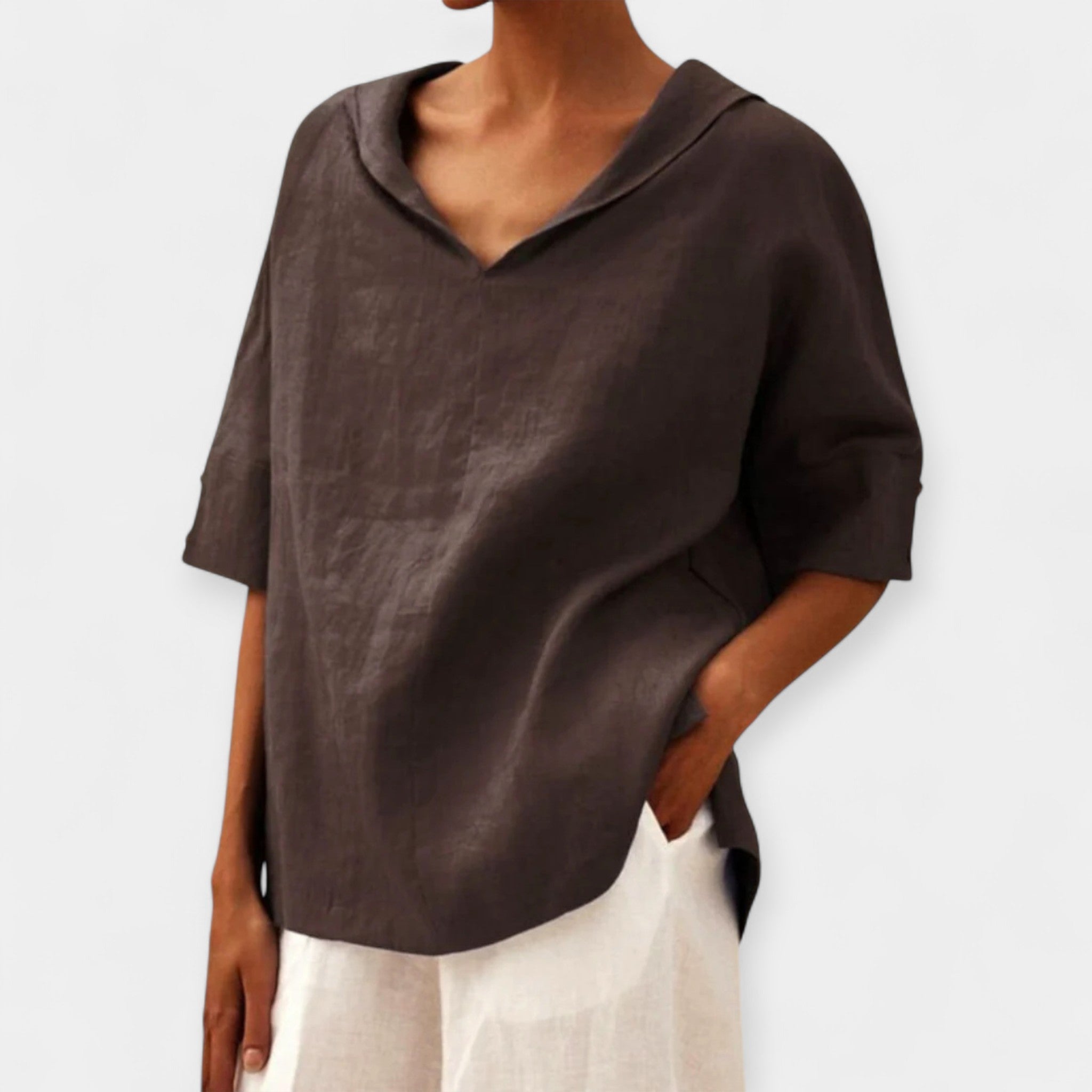 Green wide-cut relaxed blouse with a light, flowing silhouette and casual elegance