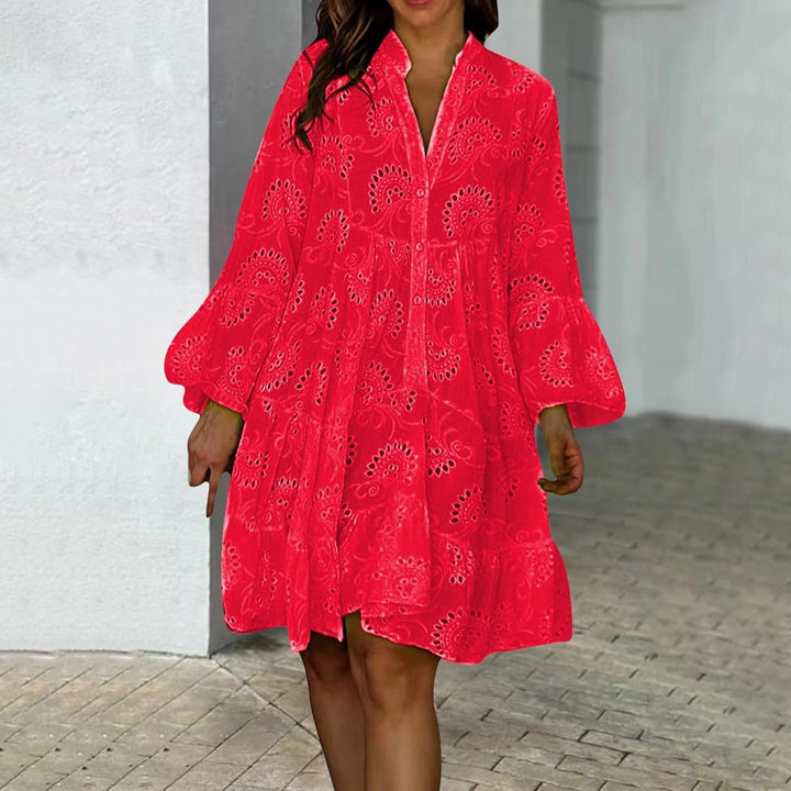 Woman in a breezy mini dress with delicate eyelet detailing and softly tiered skirt.