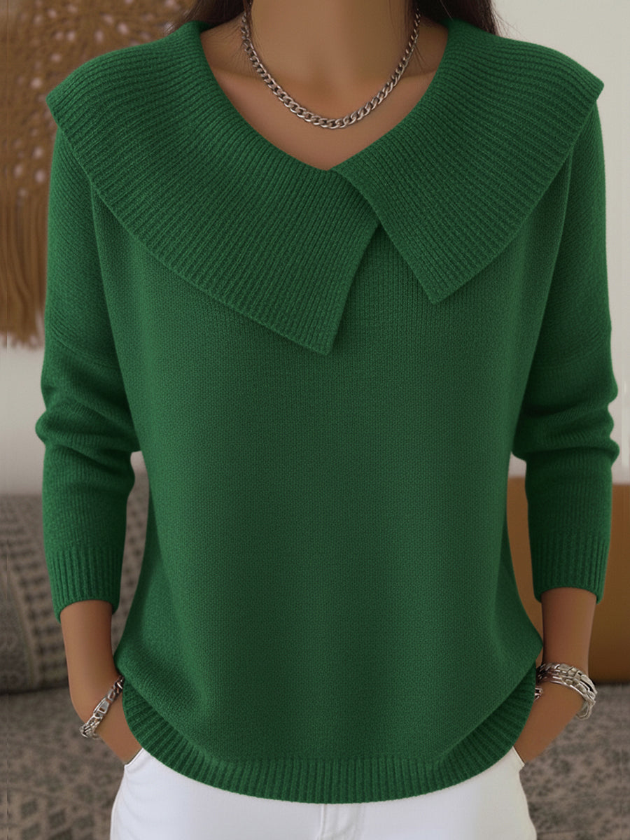 A woman wearing a soft collared jumper styled elegantly for a festive occasion.