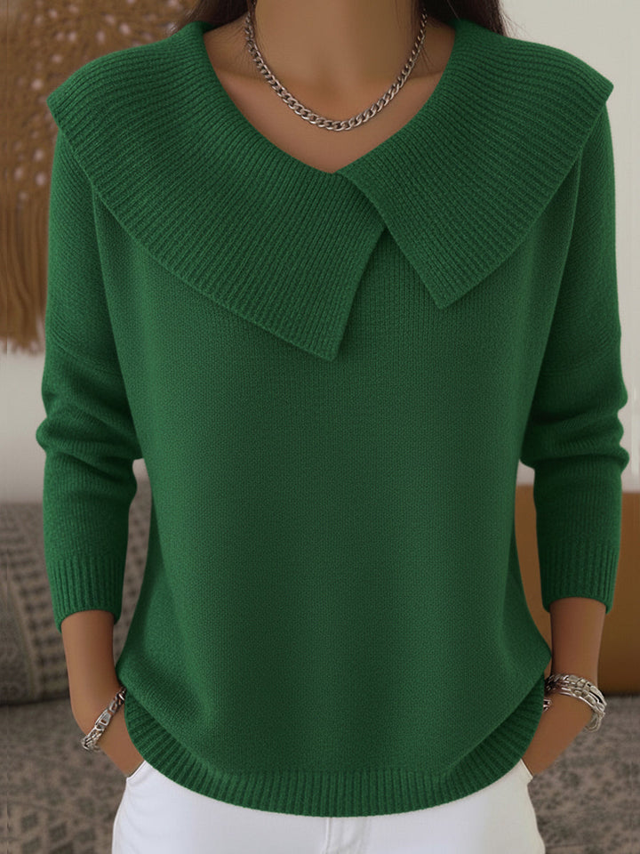 A woman wearing a soft collared jumper styled elegantly for a festive occasion.