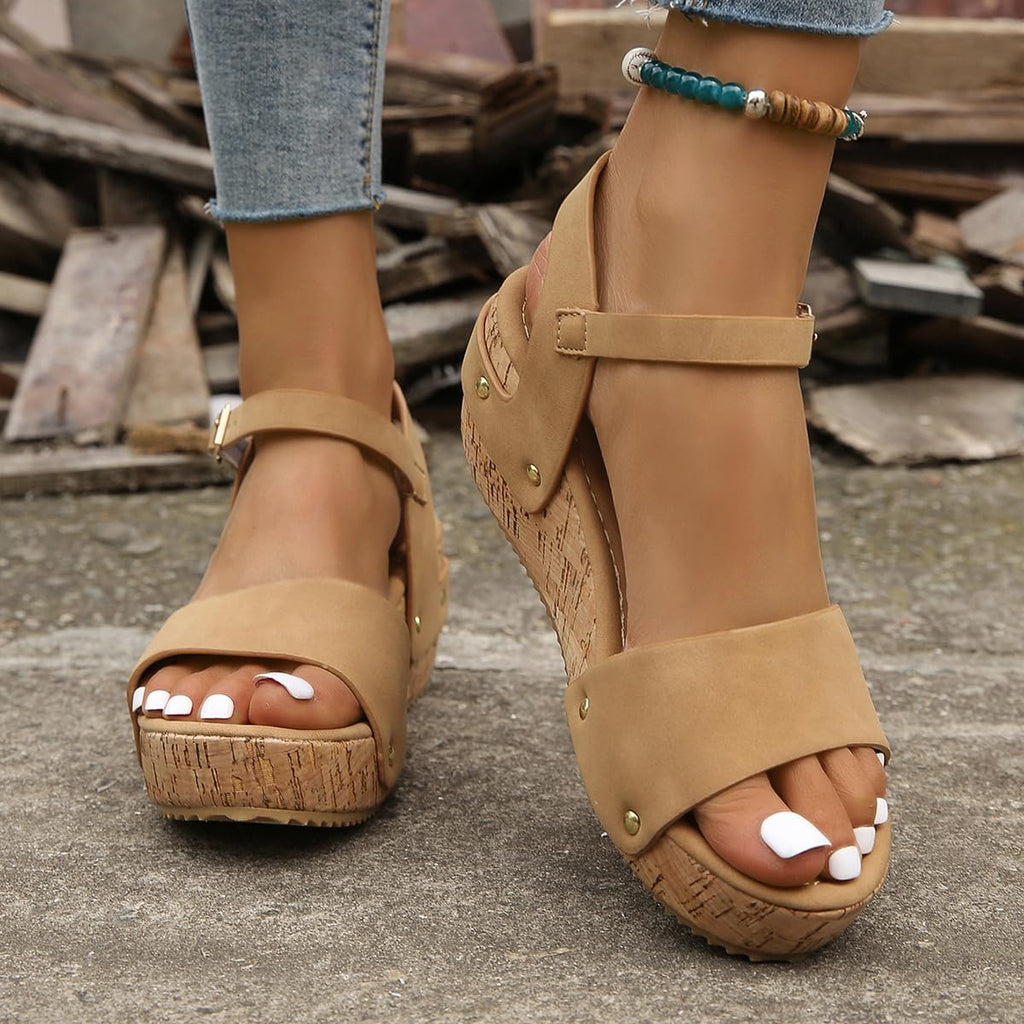 Platform sandals in black with an ankle strap and a clean, structured sole