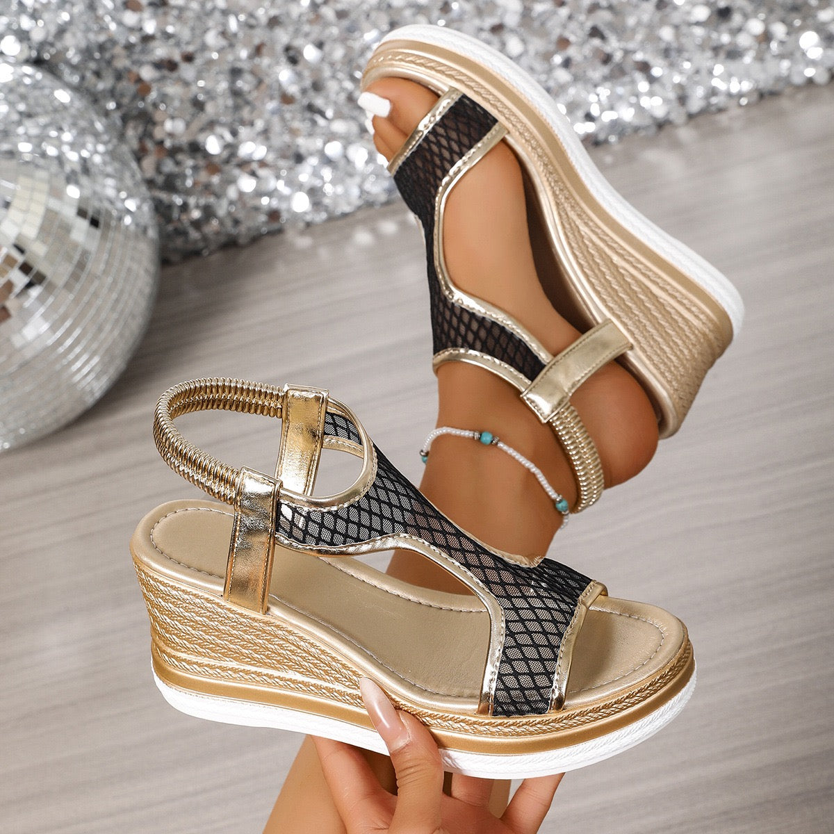 Elegant wedge sandals with a shimmer embellished upper and ankle strap in black and beige